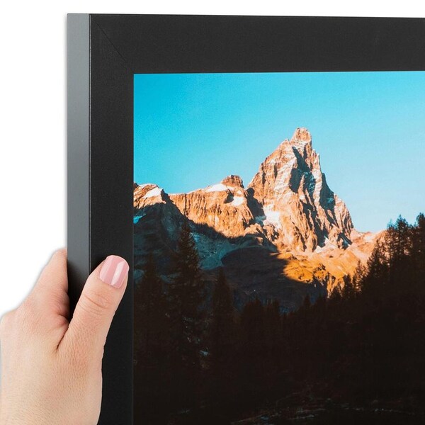 hand holding black picture frame